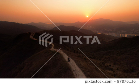 the winding path, sunset view of Wan Kok Shan, Sai Kung in Hong Kong with the townscape 87876136