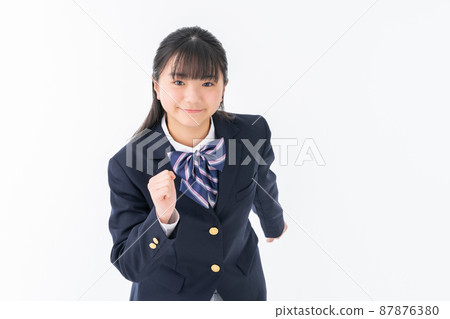 Junior high school student running on a white background Junior high school student running on a white background 87876380