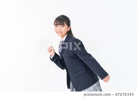 Junior high school student running on a white background Junior high school student running on a white background 87876395
