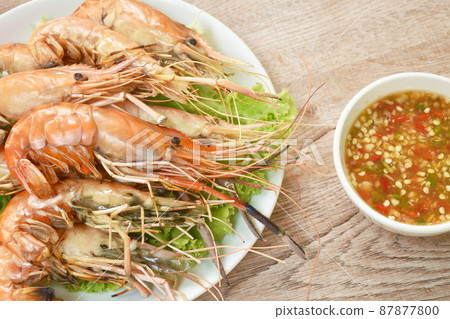 grilled river shrimp arranging with fresh lettuce on plate dipping spicy sauce grilled river shrimp arranging with fresh lettuce on plate dipping spicy sauce 87877800