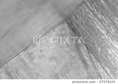 dry wood and grey rough cement wall black and white background 87878424