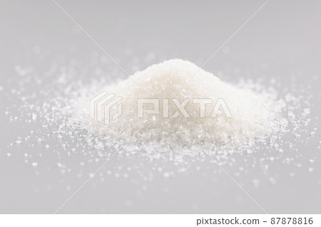 Sugar crystals pile on grey background, heap of sweet powder, sugar substitute Sugar crystals pile on grey background, heap of sweet powder, sugar substitute 87878816