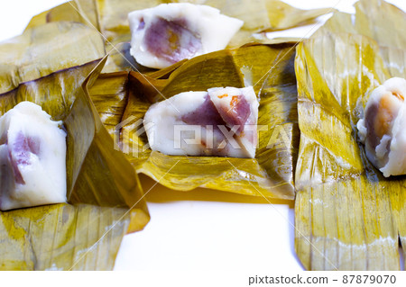 Steamed coconut custard with sweet coconut filling Steamed coconut custard with sweet coconut filling 87879070