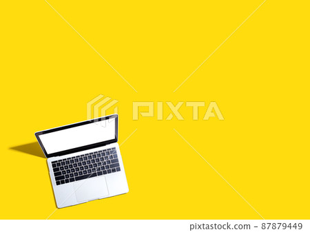 Laptop computer with shadow from above Laptop computer with shadow from above 87879449