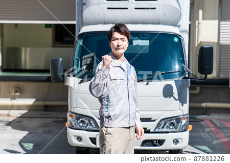 Workers guts pose in front of the truck Workers guts pose in front of the truck 87881226