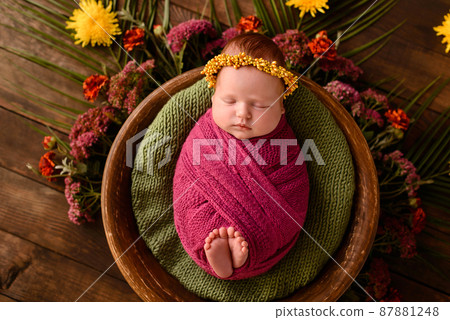 Close-up beautiful sleeping baby girl. Newborn baby girl, asleep on a blanket Close-up beautiful sleeping baby girl. Newborn baby girl, asleep on a blanket 87881248