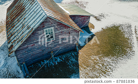 Collapsing red buiilding in winter Collapsing red buiilding in winter 87881836