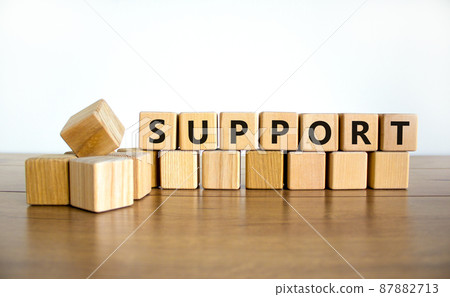 Support symbol. The concept word Support on wooden cubes. Beautiful wooden table, white background, copy space. Business and support concept. 87882713
