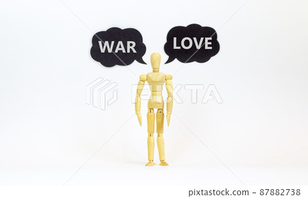 Make love not war symbol. Concept words Love and War. Wooden model of businessman human. Black paper. Beautiful white background, copy space. Social and make love not war concept. 87882738