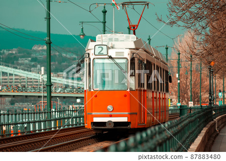 View of a vintage red tram 87883480