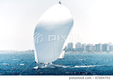 Sailing boat during a regatta in mediterranean sea 87884703