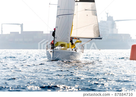 Yacht in action during a race in the mediterranean sea 87884710
