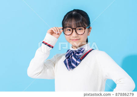 Junior high school student with blue background glasses 87886279
