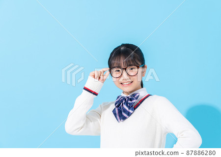 Junior high school student with blue background glasses 87886280