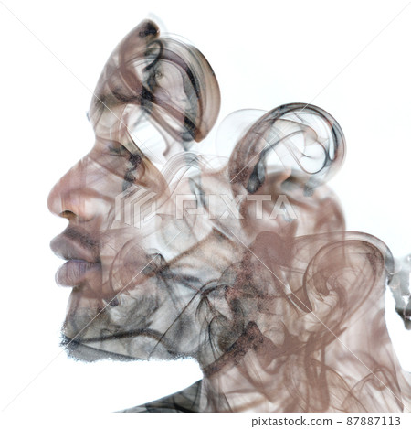 An image of smoke combined with a portrait of an African man 87887113