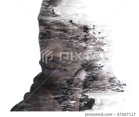 A portrait of a man combined with digital art in a double exposure technique 87887117