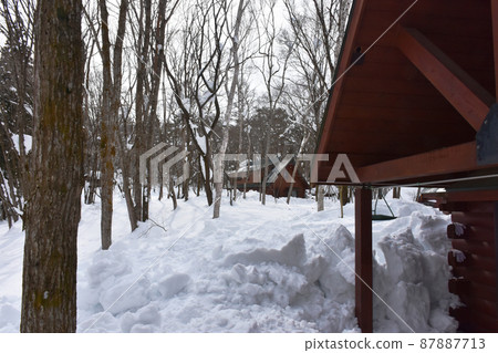 Log house buried in snow Log house buried in snow 87887713