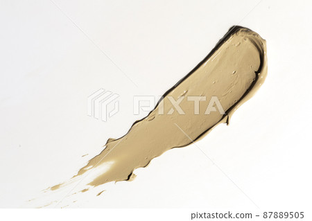 Creamy foundation smeared on white background. Isolated. Beauty and fashion conception. 87889505