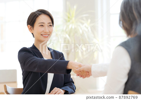 Business scene handshake 87892769