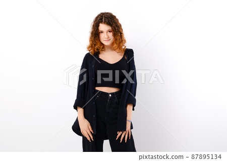 Tricky girl in casual clothing with colored ends of hair looks with a smile Tricky girl in casual clothing with colored ends of hair looks with a smile 87895134