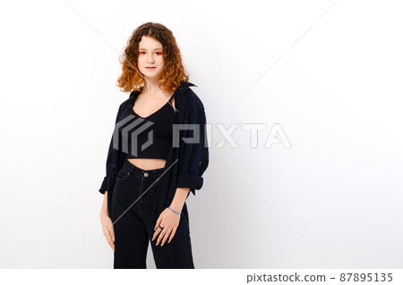Beautiful teenage girl in casual clothing with colored in red ends of hair Beautiful teenage girl in casual clothing with colored in red ends of hair 87895135