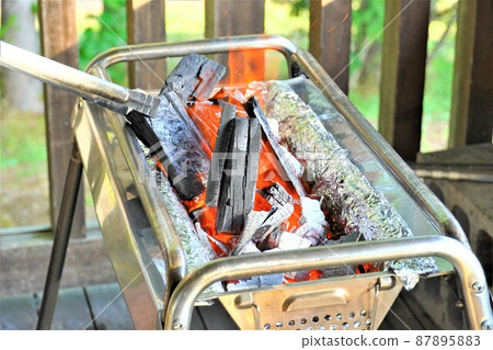 Barbecue stove and charcoal fire 87895883