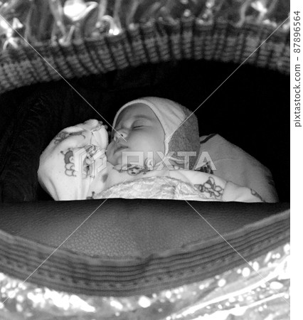 Beautiful sleeping baby boy with child hat posing photographer 87896564