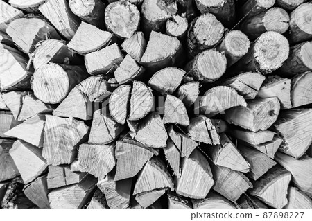 Photography on theme big wall of stacked oak tree logs in cracks Photography on theme big wall of stacked oak tree logs in cracks 87898227