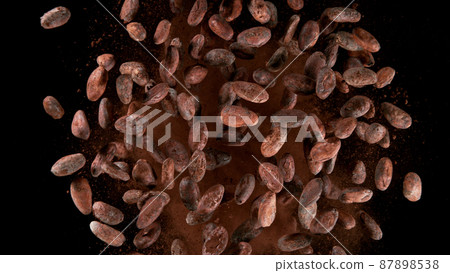 Cocoa beans flying in the air in freeze motion. 87898538