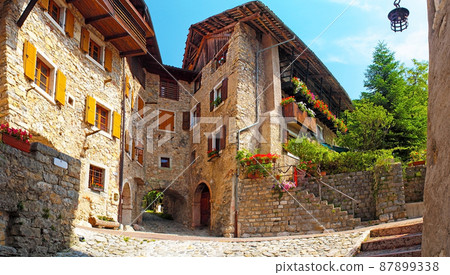 Canale di Tenno, Italy - Beautiful medieval village near the lake Lago di Garda, historic village in the mountains with houses with stone walls, cobbled streets Canale di Tenno, Italy - Beautiful medieval village near the lake Lago di Garda, historic village in the mountains with houses with stone walls, cobbled streets 87899338