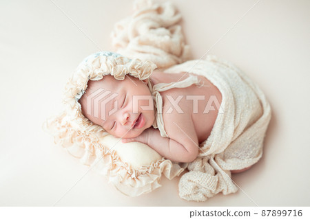 Happy newborn baby sleeping 87899716