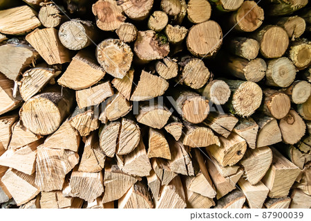 Photography on theme big wall of stacked oak tree logs in cracks Photography on theme big wall of stacked oak tree logs in cracks 87900039