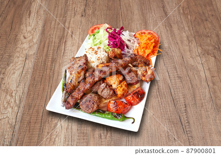 Mixed meats and vegetables on wooden table Mixed meats and vegetables on wooden table 87900801