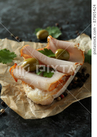 Delicious bruschetta snack on black smokey background 87905424