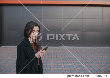 brunette cute girl talking by the phone brunette cute girl talking by the phone 87906131