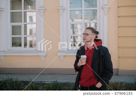 Takeaway coffee is my lifestyle. Handsome man hold coffee cup outdoors. Young guy drink coffee on summer morning. Enjoying coffee Takeaway coffee is my lifestyle. Handsome man hold coffee cup outdoors. Young guy drink coffee on summer morning. Enjoying coffee 87906185