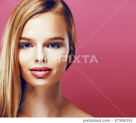 young pretty blonde real woman with hairstyle close up and makeup on pink background smiling young pretty blonde real woman with hairstyle close up and makeup on pink background smiling 87906391