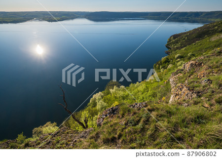 Amazing spring sunset view on the Dnister River Canyon, Bakota Bay, Khmelnytsky region, Ukraine. Amazing spring sunset view on the Dnister River Canyon, Bakota Bay, Khmelnytsky region, Ukraine. 87906802