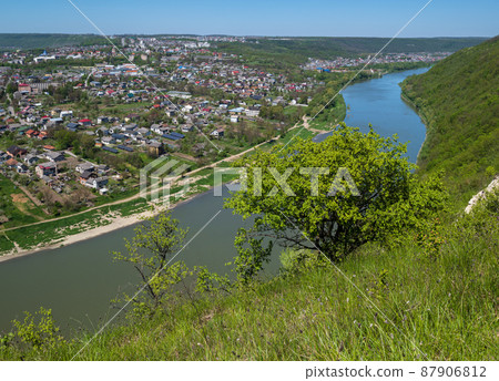 Amazing spring view on the Dnister River Canyon. View to Zalishchyky town,  Ternopil region, Ukraine. 87906812