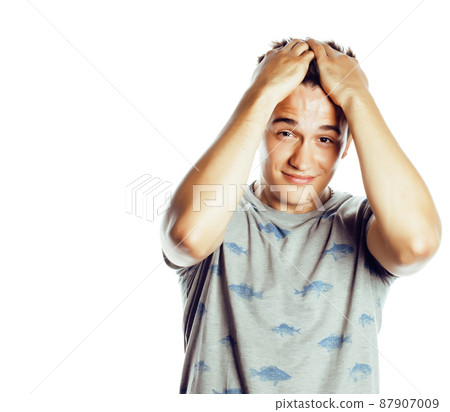 young attractive man isolated thinking emotional on white closeup gesturing smiling, lifestyle people concept young attractive man isolated thinking emotional on white closeup gesturing smiling, lifestyle people concept 87907009