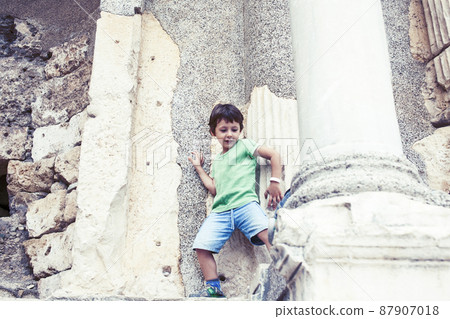 little boy exploring ancient architecture, lifestyle people on summer vacation little boy exploring ancient architecture, lifestyle people on summer vacation 87907018