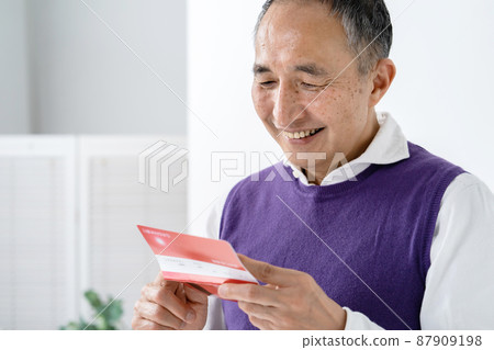 Senior men happy to see passbooks Senior men happy to see passbooks 87909198