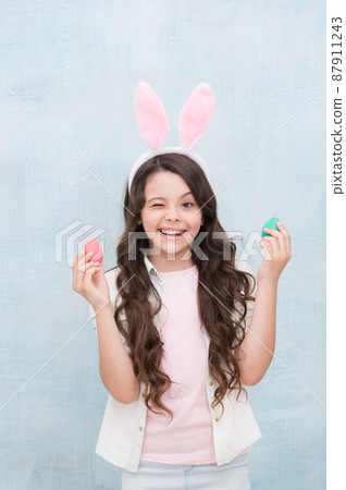 Carefree time. Holiday gifts and presents. Girl with Easter  87911243