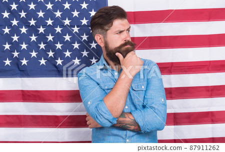Man well groomed hipster stylish appearance american flag background, life changing decision concept Man well groomed hipster stylish appearance american flag background, life changing decision concept 87911262