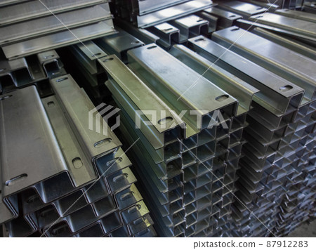 full frame view on stacks of profile bent sheet metal parts full frame view on stacks of profile bent sheet metal parts 87912283