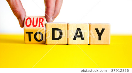 Today is our day symbol. Businessman turns the wooden cube and changes concept words Today to our day. Beautiful white background, copy space. Business, motivation today is our day concept. 87912856