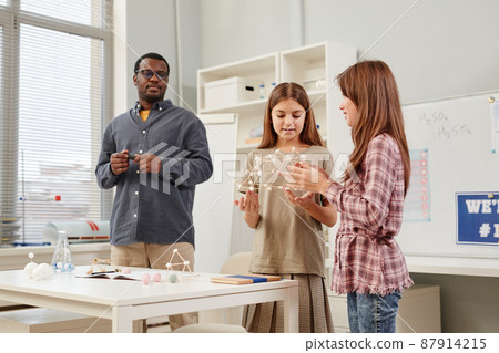 Girls in Science Class Answering by Blackboard 87914215