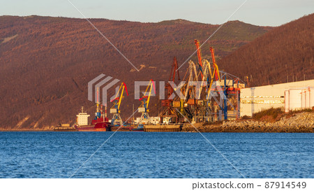 Morning view of the cargo seaport and mountains 87914549