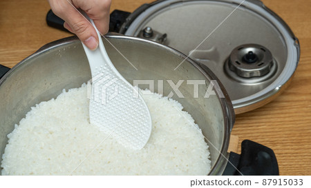 Rice cooked in a pressure cooker | Freshly cooked white rice image 87915033