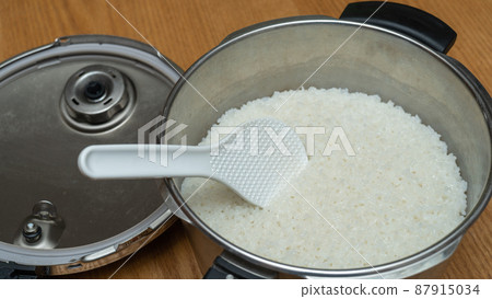 Rice cooked in a pressure cooker | Freshly cooked white rice image 87915034